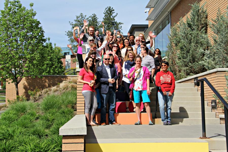 <who> Photo Credit: KelownaNow.com </who> Students, faculty and family enjoy the new rainbow staircase at UBCO.