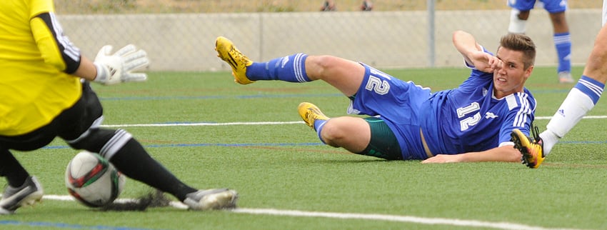 <who>Photo Credit: Lorne White/KelownaNow </who>Luke Warkentin of the UBCO Heat watches as UBC Thunderbirds Chad Bush makes a save on his shot late in the second half of Sunday's CIS Canada West match at Nonis Field. The Heat and T-Birds played to a 1-1 draw.
