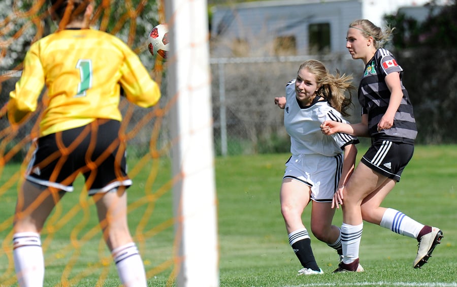 Kristen Naude, centre, and the Kelowna Christian School Knights finished third at the Valley tournament.