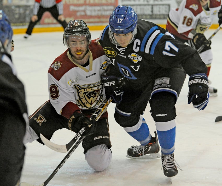 <who>Photo Credit: Lorne White/KelownaNow </who>Tyson Jost, right, here battling with West Kelowna Warriors' Brett Mennear, during the BCHL Interior Division final series at Royal LePage Place, has been drafted by the Colorado Avalanche.