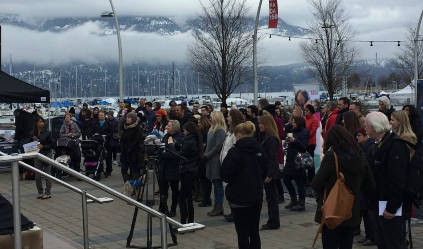 <who> Photo Credit: KelownaNow </who> Despite the cold, a large crowd gathered at Stuart Park in Kelowna to celebrate International Women's Day on March 8, 2018.