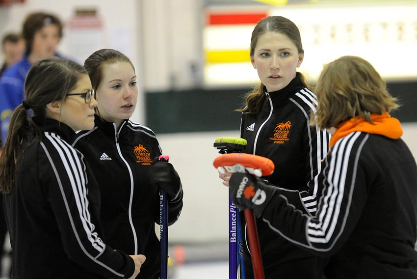 <who>Photo Credit: Lorne White/KelownaNow.com </who>The Thompson Rivers rink of, from left, Nordin Ashley, Samantha Fisher, Erin Pincott and Corryn Brown discuss strategy at the KCC.