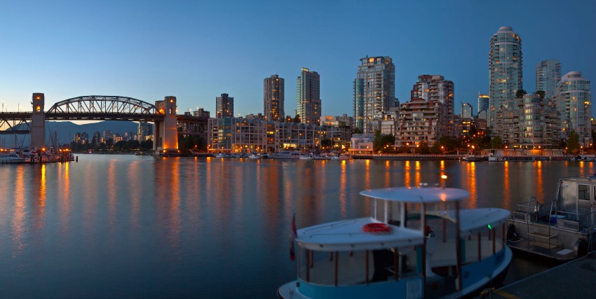 </who> The Vancouver skyline with a view of Burrard bridge over False Creek.