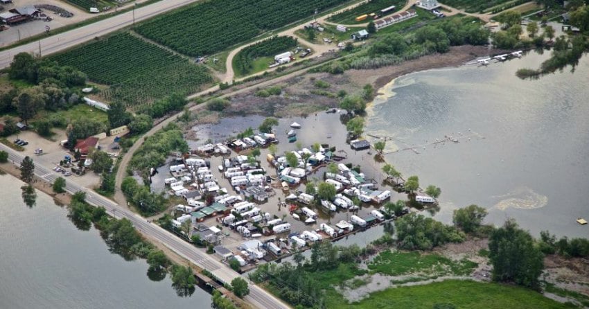 <who> Photo Credit: KelownaNow. </who> Aerial shot of Lake Country's flooding in May of 2017.