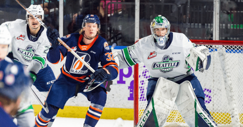 Thunderbirds goaltender Thomas Milic wards off Blazers centre Drew Englot.
