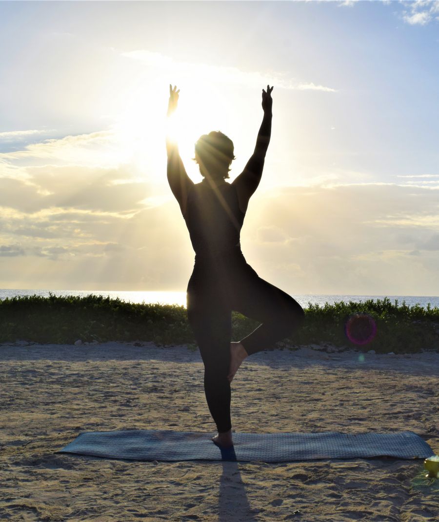 </who>Yoga instructor Pamela Caceres strikes a pose at sunrise at the Hilton Tulum All-Inclusive Resort.