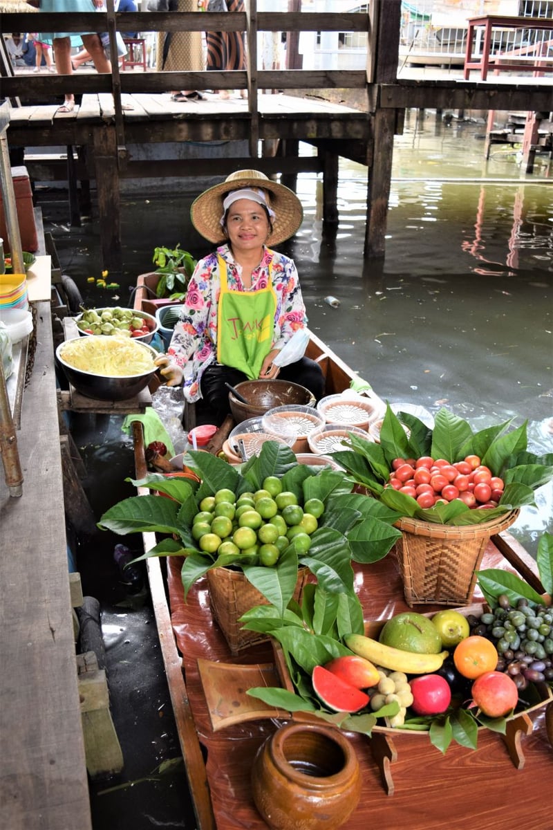 </who>This vendor, above, will chop up a customized salad for you at Taling Chan Floating Market in Bangkok. Below, baby Saiyok at ElephantsWorld.