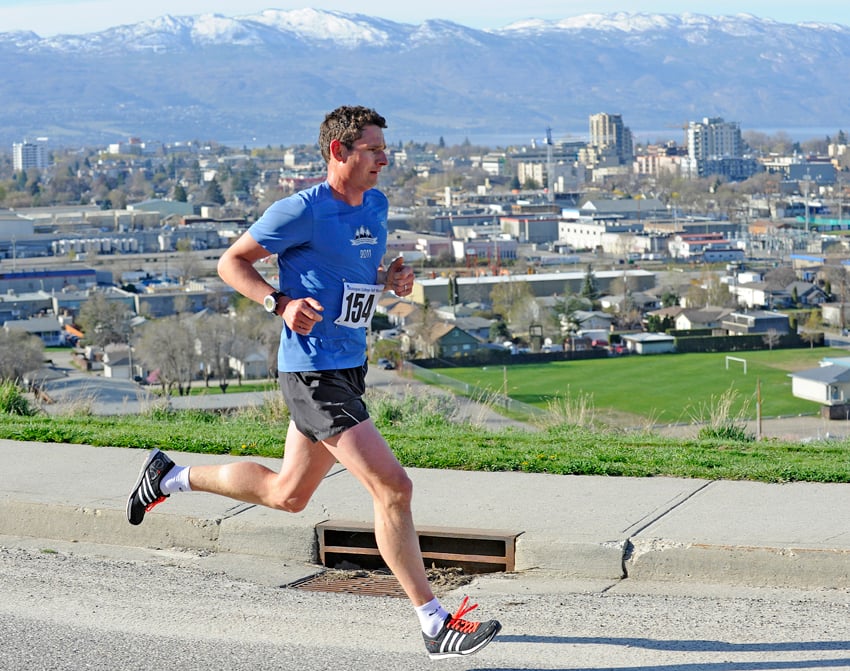 <who>Photo Credit: Lorne White/KelownaNow.com </who>Aaron Heidt of Vernon runs along Royal View Drive on the way to a second-place finish in the Okanagan College Half Marathon on Sunday.