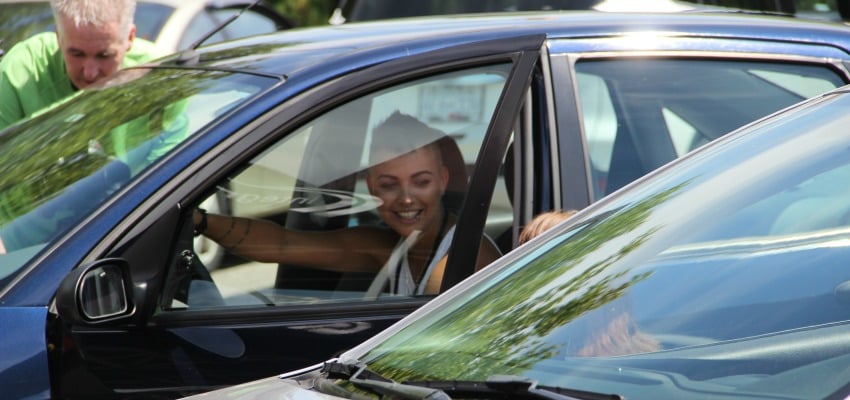 <who> Photo Credit: KelownaNow. </who> Crystal Matheson, 26, in her new car. 