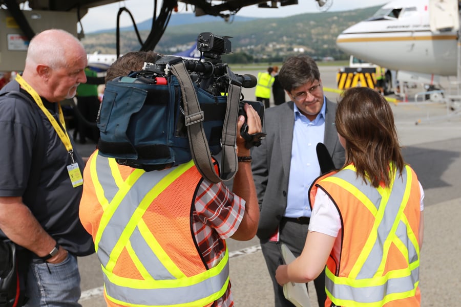 <who>KelownaNow</who>NewLeaf CEO Jim Young speaks to reporters at Kelowna airport Monday.