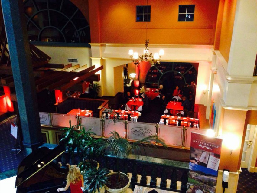<who> Photo Credit: Delta Grand Hotel </who> The Grand Bay Cafe as it currently looks.