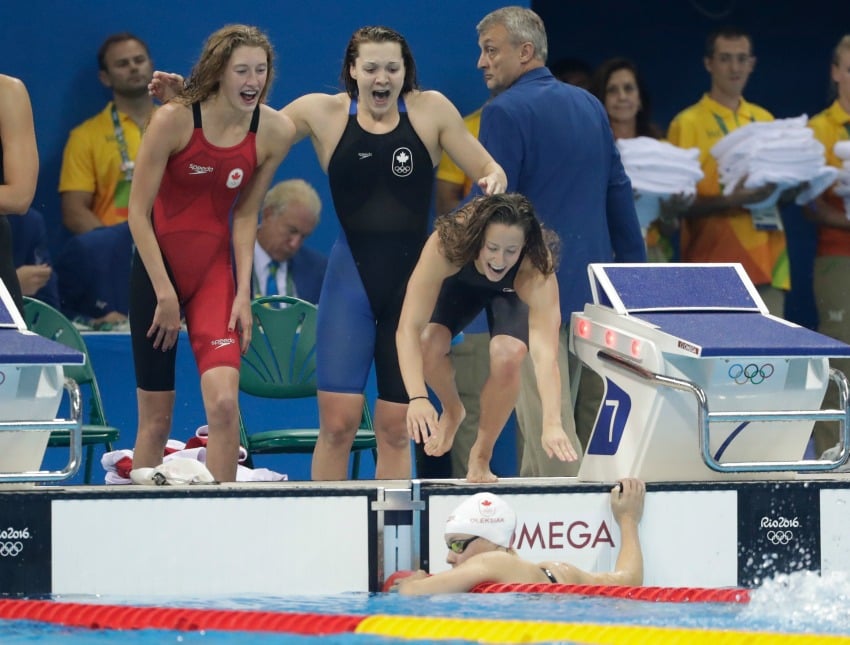 <who> Photo Credit: Canadian Olympic Committee, Mark Ranson. </who> From L to R: Taylor Ruck, Brittany MacLean, Katerine Savard, and Penny Oleksiak (in the pool). 
