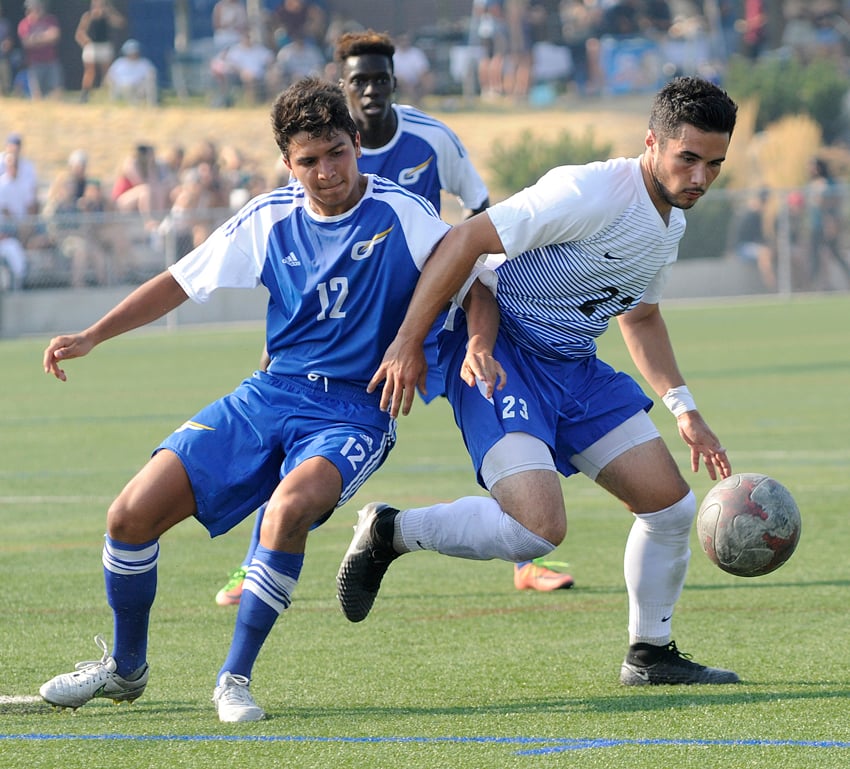 <who>Photo Credit: Lorne White/KelownaNow </who>Juan Pinos, left, of the UBCO Heat was selected as the home team's player of the game on Sunday vs UVic.