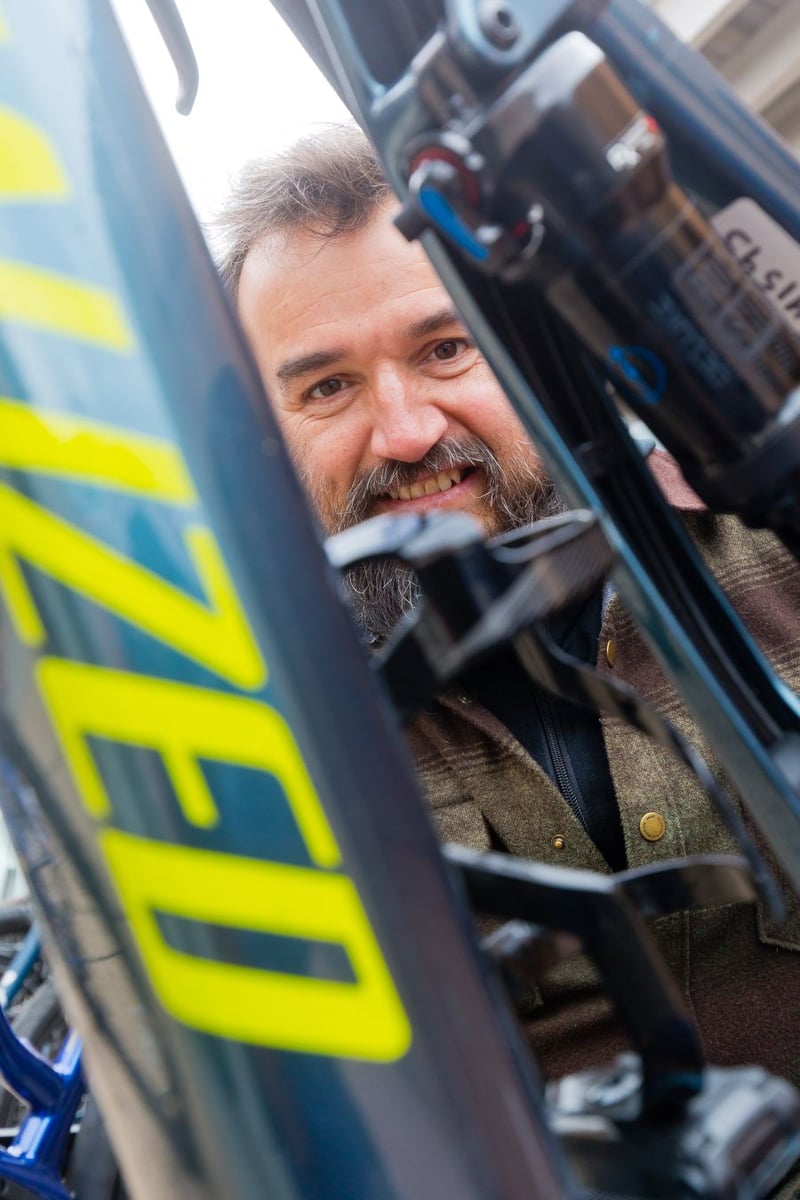 <who>Photo Credit: NowMedia</who> Kurt Flaman tunes up a "Light Electric Vehicle"
