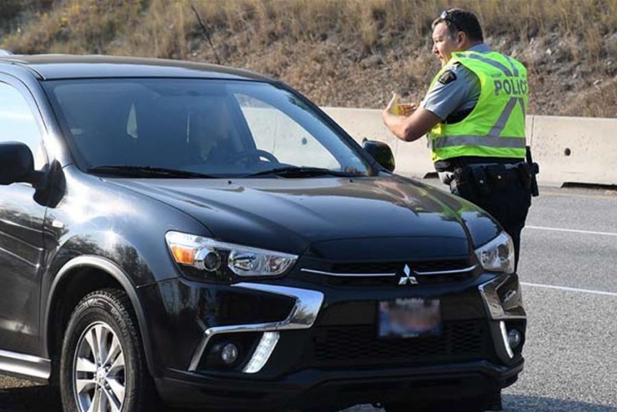 <who>Photo Credit: Kelowna RCMP</who>Cst. Brad Smith in action.