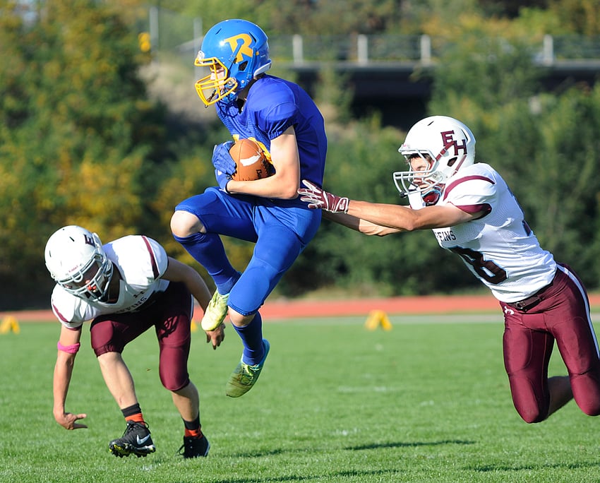 Rutland"s Coltin Peterson leaps to grab a touchdown pass in the first quarter.