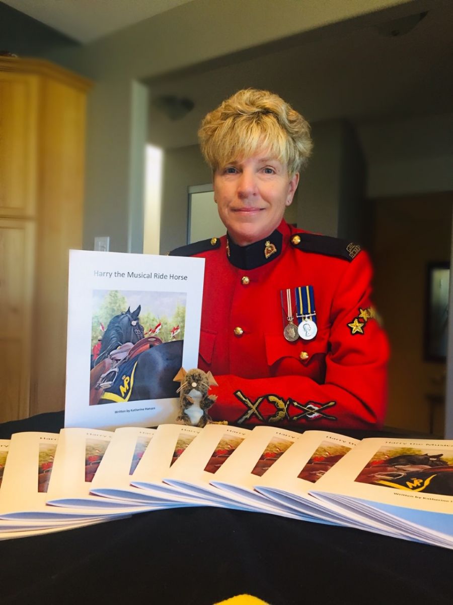 <who> Photo Credit: Photo Contributed </who> Katherine Hansen and her new book focused on RCMP Musical Ride.