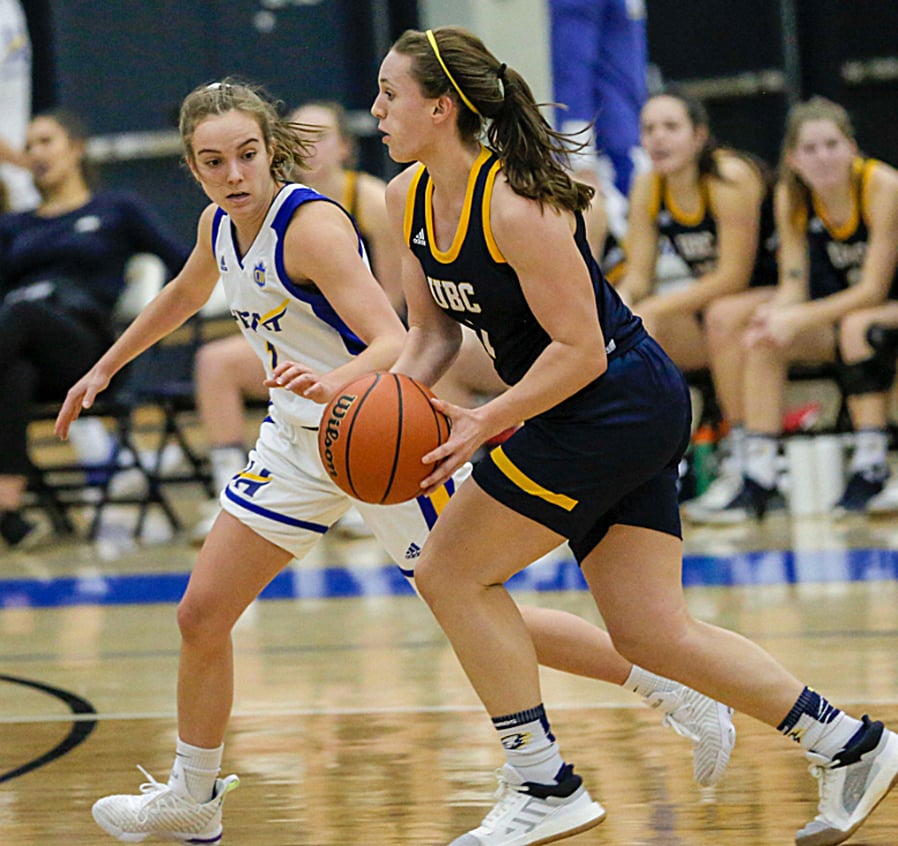 Kelowna's Kasey Patchell, left, made her Canada West debut with a team-high 10-point performance for the Heat while Immaculata High School grad, Kate Johnson scored 15 points for the UBC Thunderbirds.