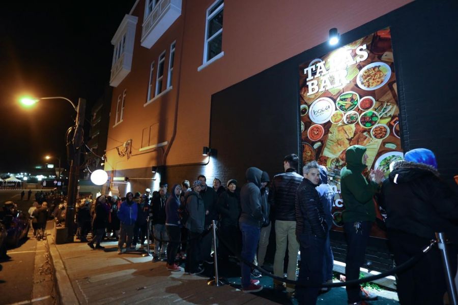 <who>Photo Credit: Canadian Press</who>People line up to buy legal cannabis in St. John's