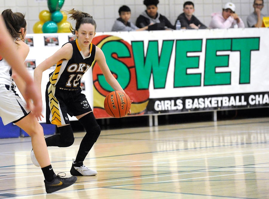 <who>Photo Credit: Lorne White/KelownaNow </who>Jenna Bierwirth sets up the OKM Huskies offence in semifinal play against the KLO Cougars.