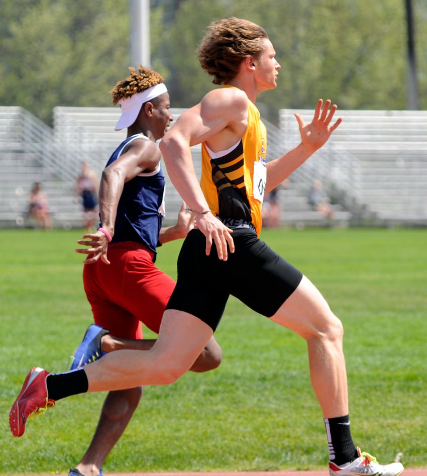 <who>Photo Credit: Lorne White/KelownaNow </who>Nolan Ulm of the KSS Owls, right, ran to three firsts and a record junior relay win.