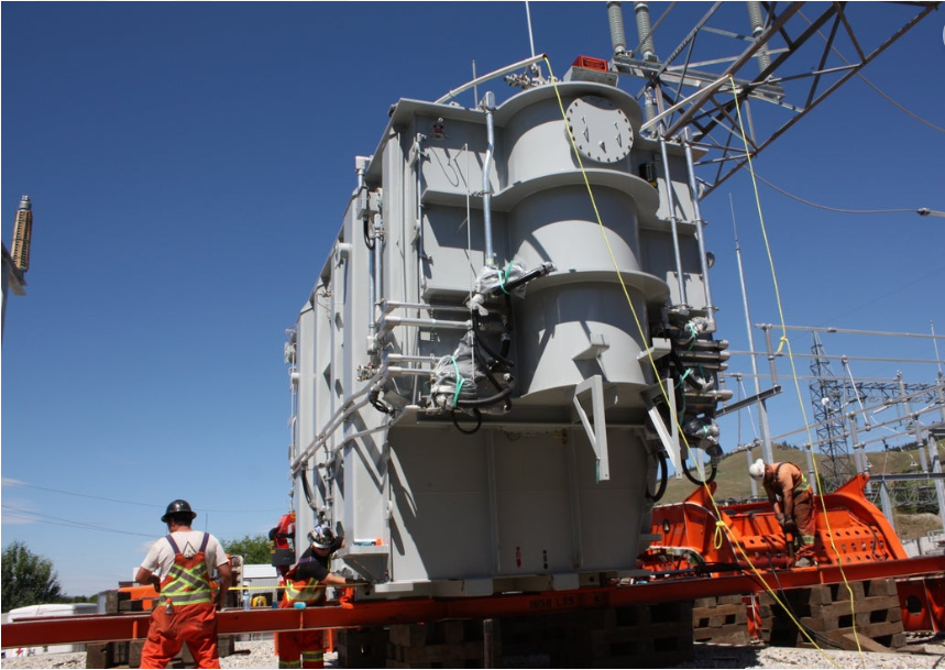 <who> Photo Credit: FortisBC </who> Crews installing a new transformer at Lee Substation in Kelowna last June as part of a $23 million expansion needed to keep up with population growth in the region.