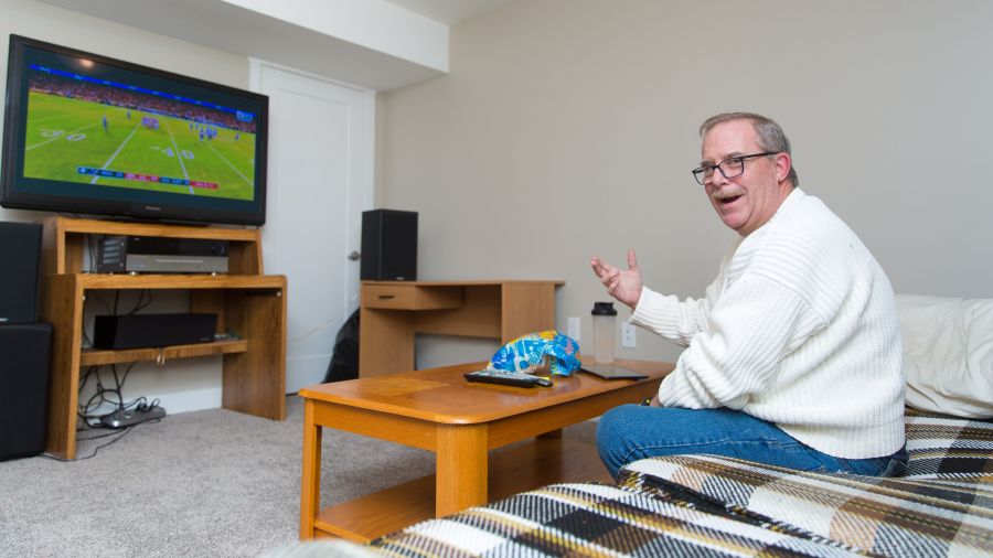 <who>Photo Credit: NowMedia</who> Brian Salter watches the NFL playoffs in his new home