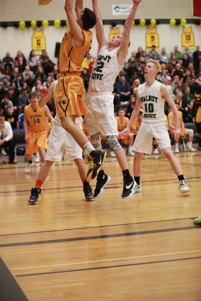 <who>Photo Credit: KelownaNow </who>The two marquee players go up at the basket.