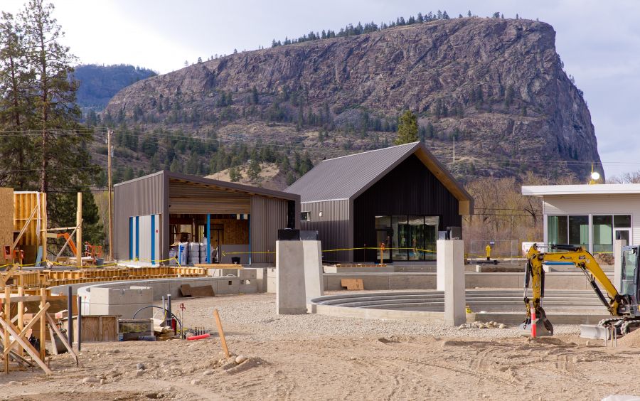<who>Photo Credit: NowMedia</who> McIntyre Bluff looms in the background in this construction shot of District Wine Village