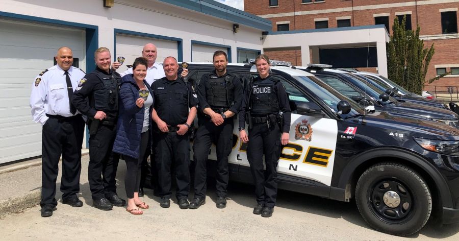 <who>Photo Credit: Nelson Police Department</who>Cst. Wade Tittemore (second from the right) was killed in an avalanche on Monday.