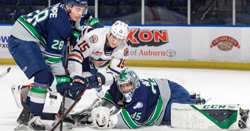 Defenceman Eric Van Impe tries to keep Blazers right winger Connor Levis from scoring in a November 2021 matchup.