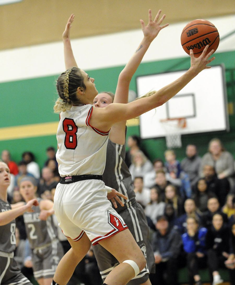 <who>Photo Credit: Lorne White/KelownaNow </who>Megan Admussen-Blair of the Okanagan College Coyotes goes up for layup against the Douglas College Royals in their home opener at Immaculata High School.