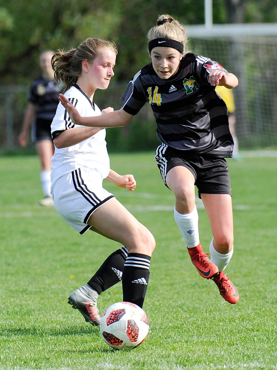 <who>Photo Credit: Lorne White/KelownaNow </who>Anna Hopley of Immaculata sidesteps an opponent.
