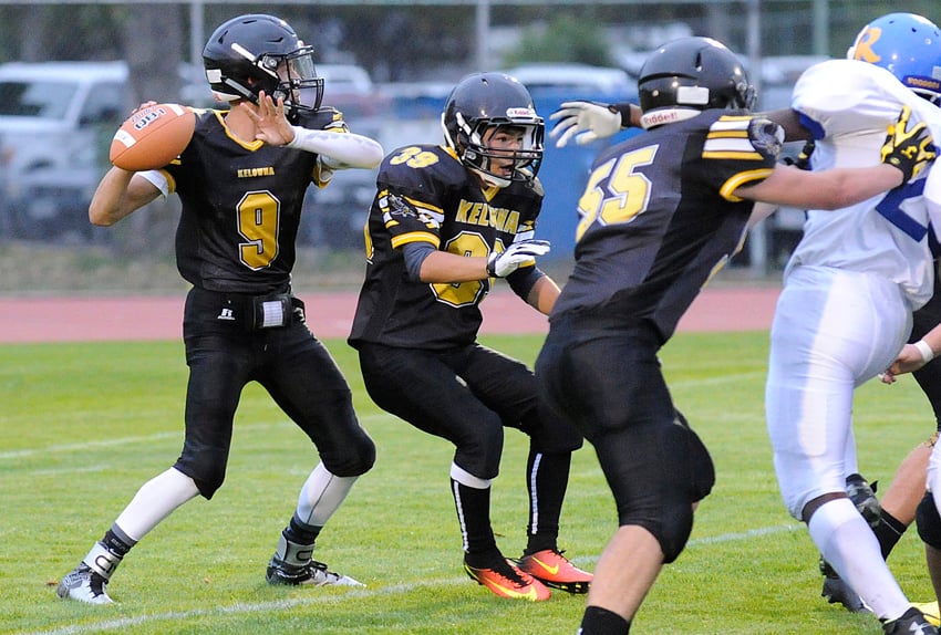 <who>Photo Credit: Lorne White/KelownaNow </who>Marcus Athans, left, led the Owls with three touchdown passes in the win over the Rutland Voodoos on Friday.