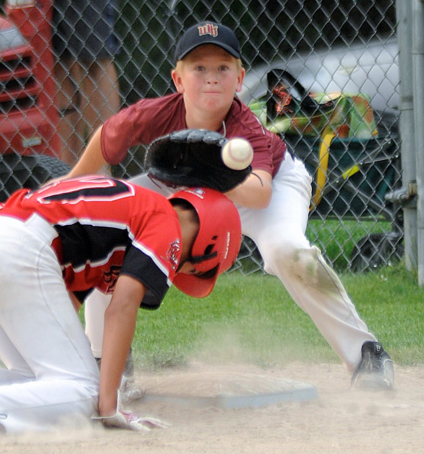 <who>Photo Credit: Lorne White/KelownaNow </who>Backs' first baseman, Jack Slusarenko, gets set to catch an attempted pick-off throw from pitcher Kaiden Davis in a provincial championship tournament game against Prince George.