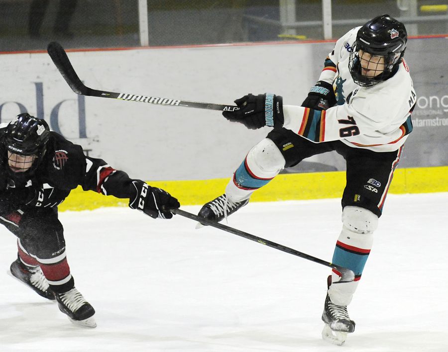 Defenceman Nolan Matthews follows through on a point shot against the AC Avalanche.