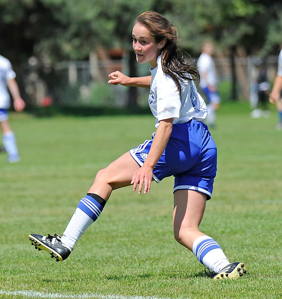 <who>Photo Credit: Lorne White/KelownaNow </who>Sydney Kolodziej of Kelowna watches as her shot finds the net for the first of her two goals in the TOFC U16's quarter-final win at Beasley Park in Lake Country.