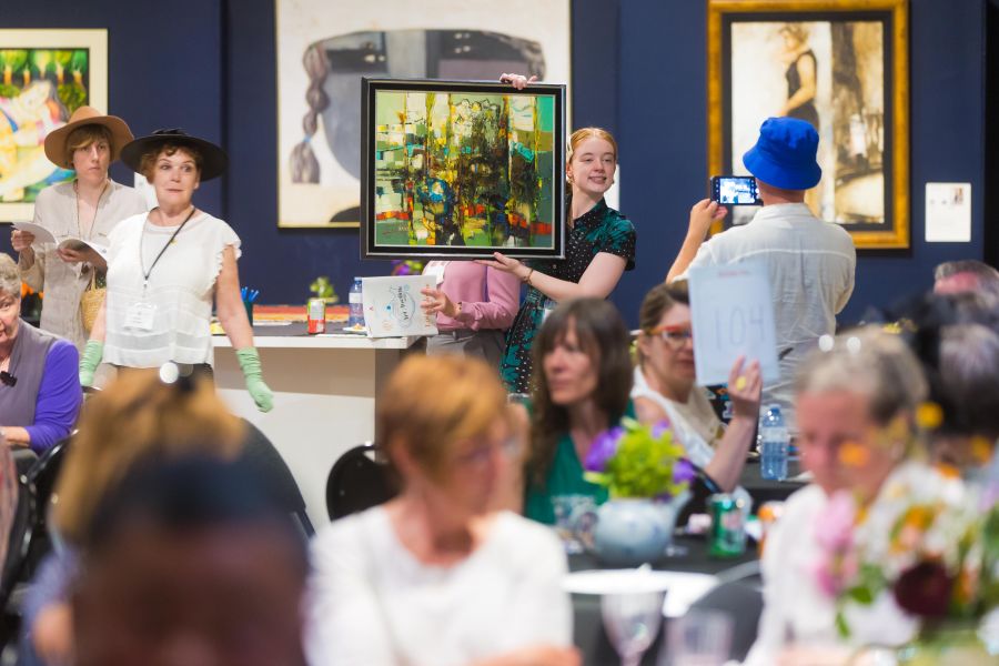 <who>Photo Credit: NowMedia/Gord Goble</who> Scene from the jam-packed 2022 Penticton Art Gallery Art Auction