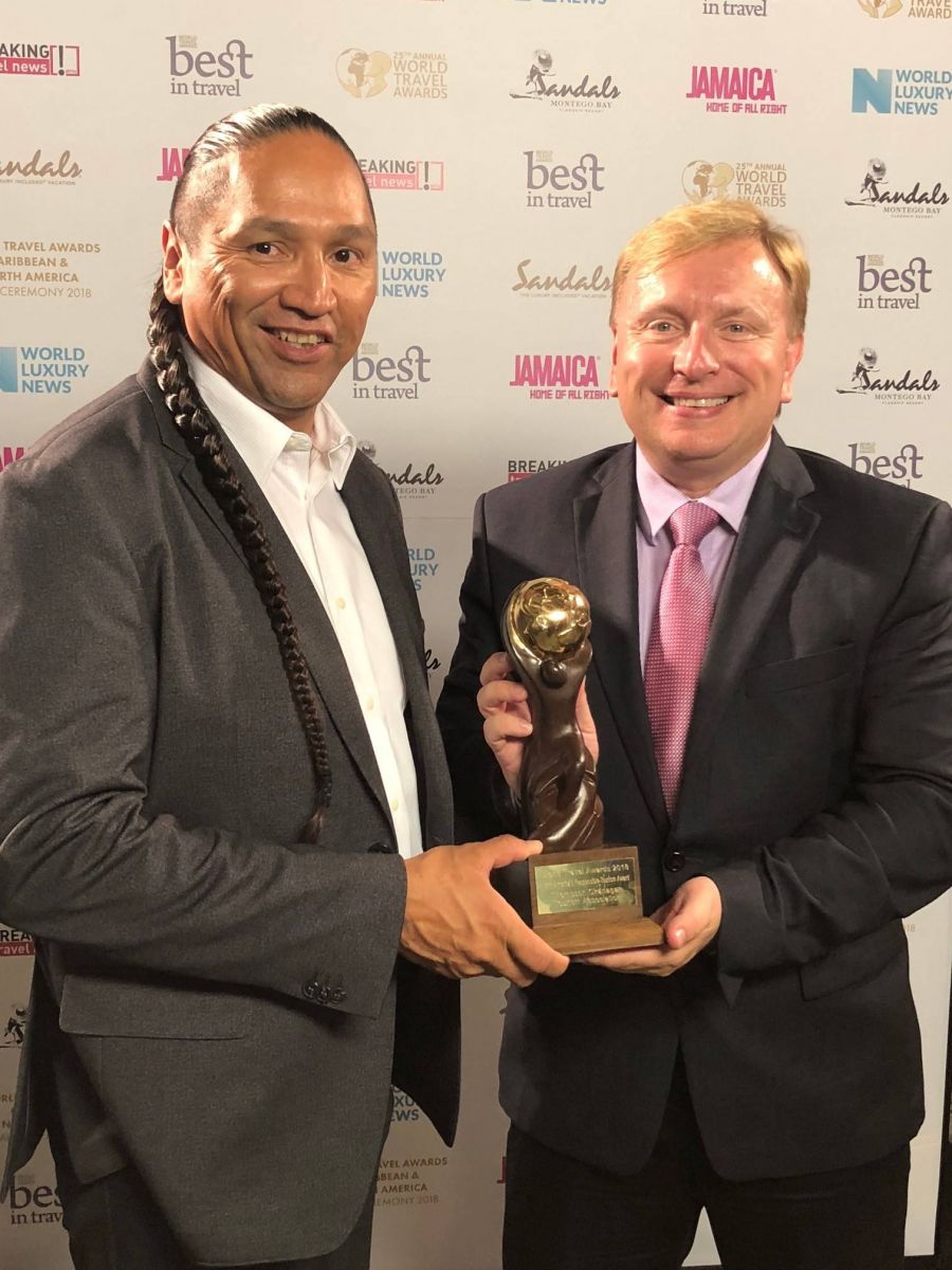 </who>The Thompson Okanagan Tourism Association has won the North America Responsible Tourism Award for a third consecutive year. This photo is from 2018 when association chair Frank Antoine, left, and association CEO Glenn Mandziuk picked up the award.