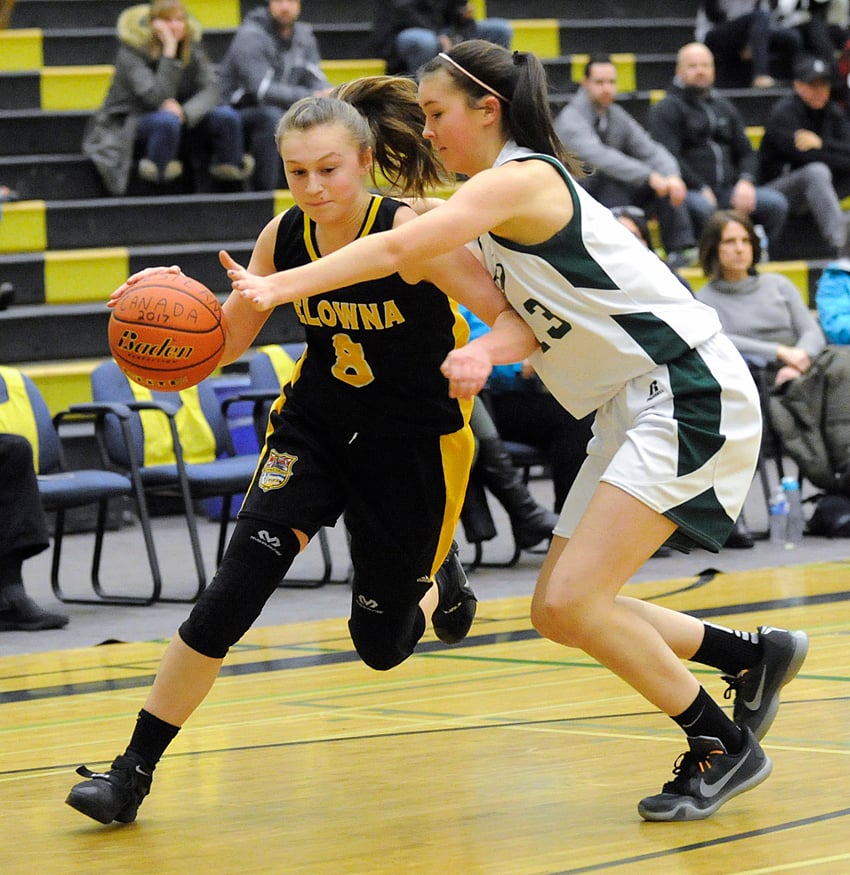 <who>Photo Credit: Lorne White/KelownaNow </who>The Owls' Rachel Ware drives to the hoop against Walnut Grove in their final game on the weekend.