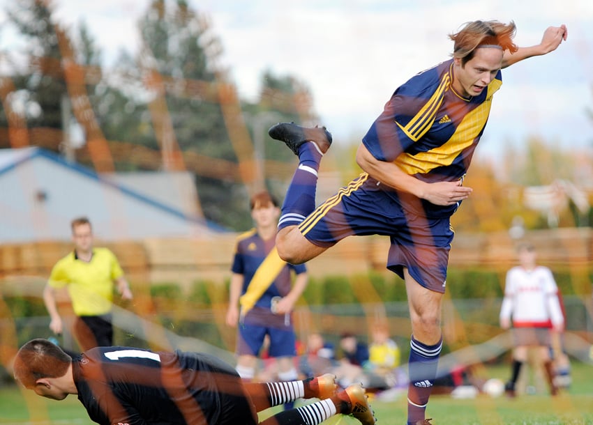OKM's Julius Kerner leaps to avoid contact with Boucherie's winning goalkeeper Tallan Freh
