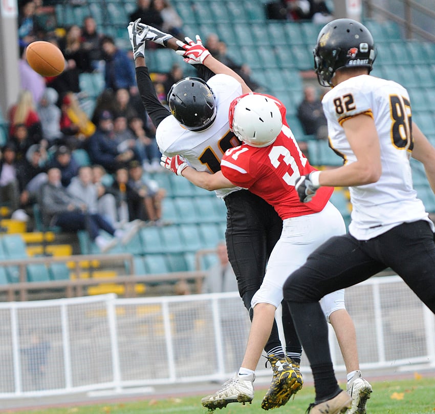 <who>Photo Credit: Lorne White/KelownaNow </who>A Nolan Ulm pass sails past the outstretched arms of Owls' Colby Miletto, being covered by Boucherie's Slade Kuchera.