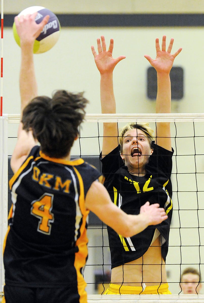 Tyson Embree of the Kelowna Owls leaps for an attempted block on OKM's Jaxon Hay.