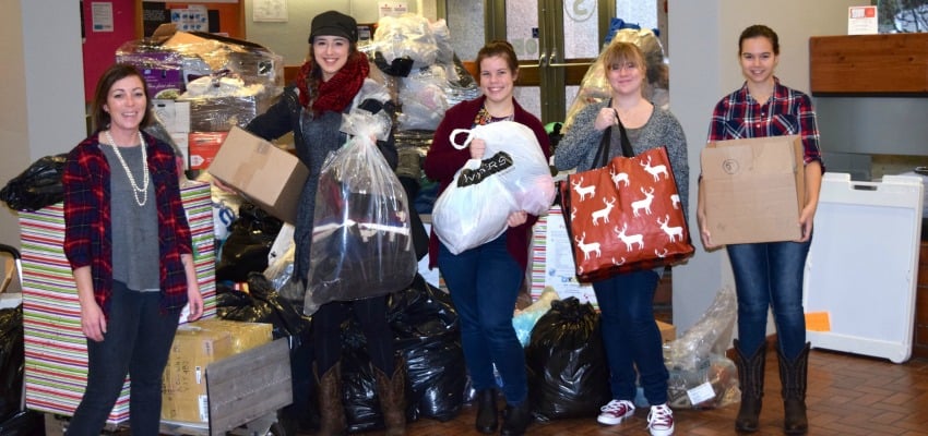 <who> Photo Credit: Contributed. </who> Okanagan College Nursing students collected six truck loads of donated warm clothing.