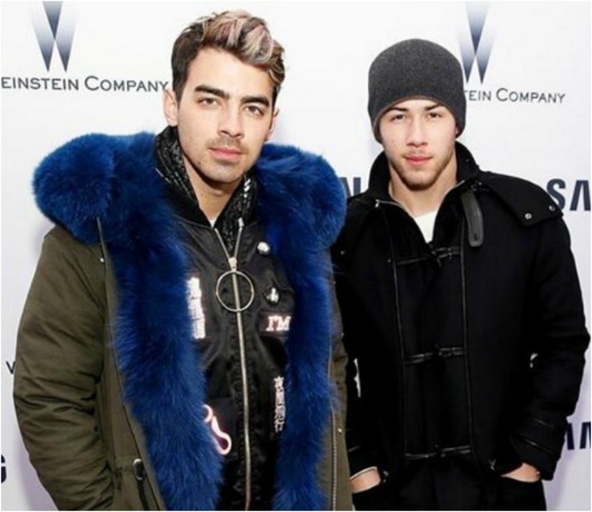 <who> Photo Credit: Moose Knuckles on Instagram. </who> Joe and Nick Jonas wearing jackets from Moose Knuckles. 