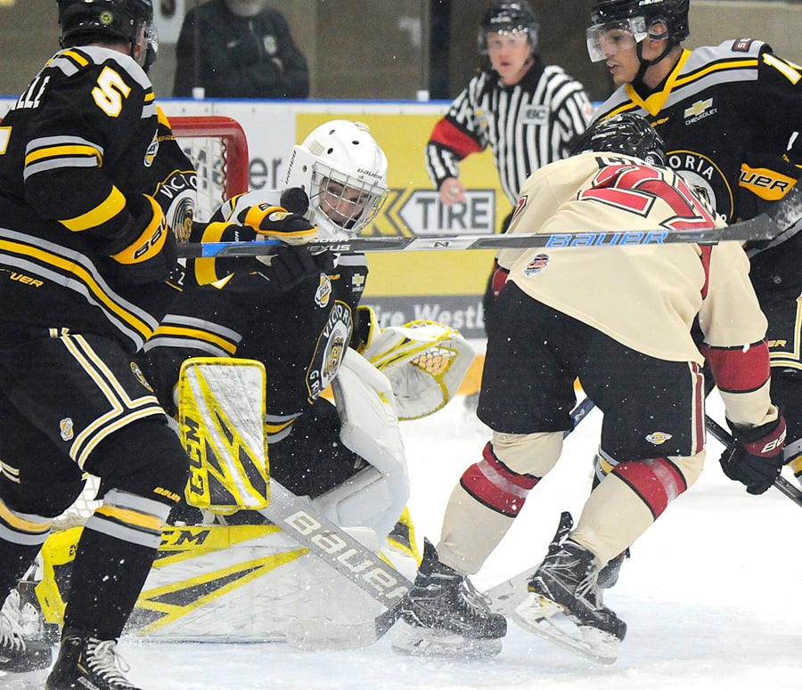 <who>Photo Credit: Lorne White/KelownaNow </who>Victoria Grizzlies' Joe Howe stops one of 40 shots, here against Lucas Cullen in the first period.