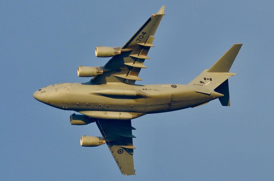 <who> Photo credit: Dave Pack </who> The CC-177 Globemaster III flying over Kelowna