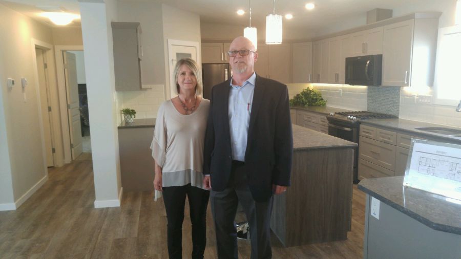 <who>Photo Credit: PentictonNow </who>Mark Huchulak, the president and CEO of Jandel Homes Ltd., and his wife Joyce, are thrilled their new Penticton sales office is officially open. The company, one of western Canada's leading retailers of modular homes, is looking to get settled in the Penticton market before moving forward with expansion plans into the Kelowna and Vernon markets.