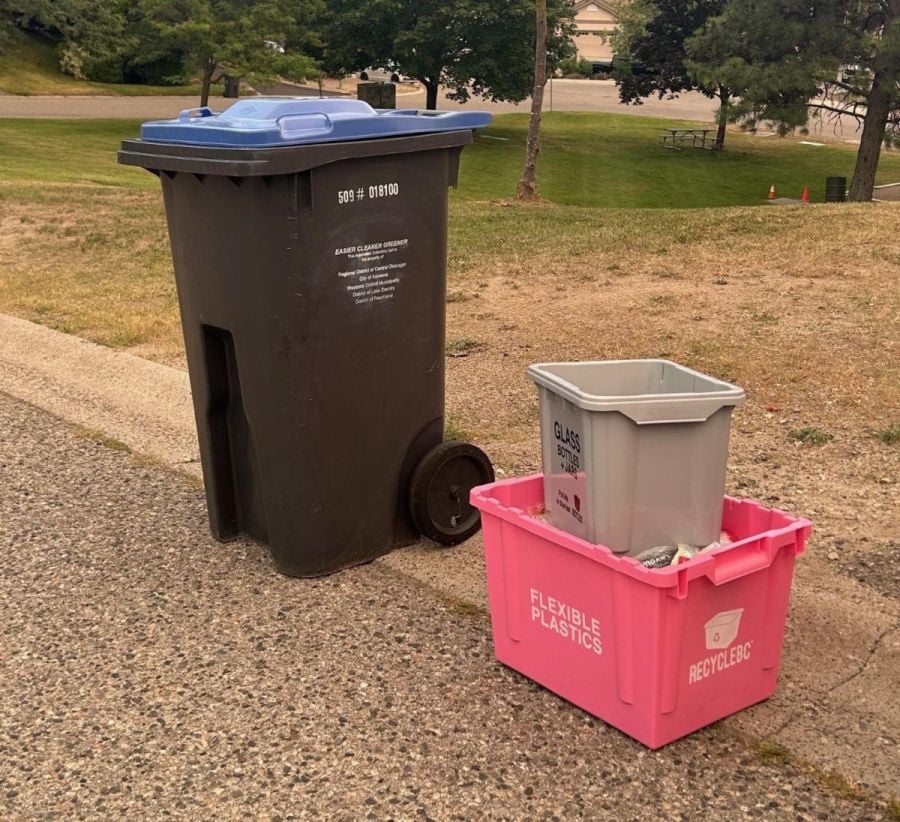 Pink and grey recycle boxes being delivered to Central Okanagan homes