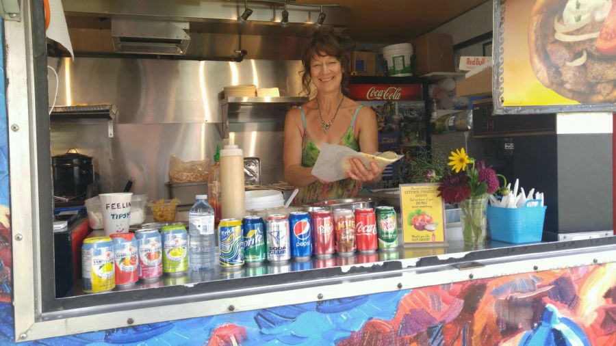 <who>Photo Credit: PentictonNow </who>Terri Lambert, owner of Opa Greek Foods, said cooking and serving her delicious Greek food to customers at Penticton Peach Festival is a labour of love.